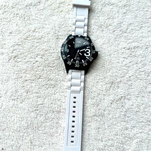 Watch with white rubber strap